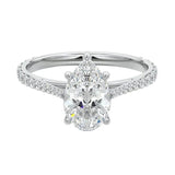 Sculpted five-claw pear cut moissanite cathedral ring with a tapered pavé gold band ApolloGem.