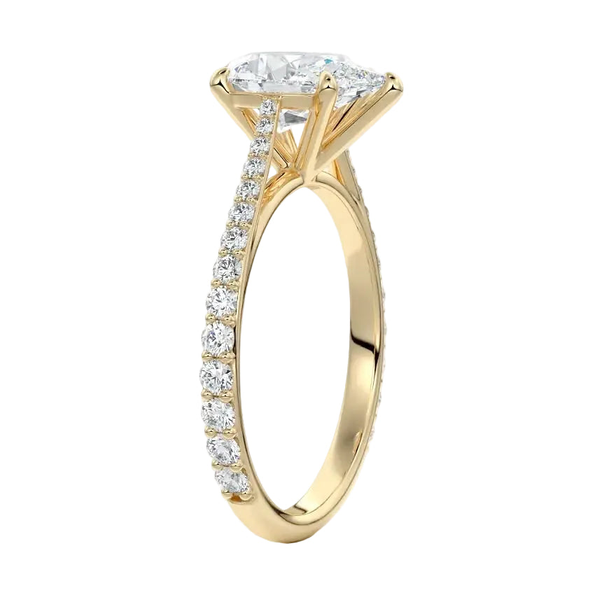 Top-down view of a D-color VVS1 pear stone in a yellow gold tapering pavé cathedral setting.