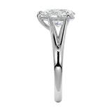 Symmetrical top-down view of a pear-cut moissanite solitaire on a decorative split white gold band.