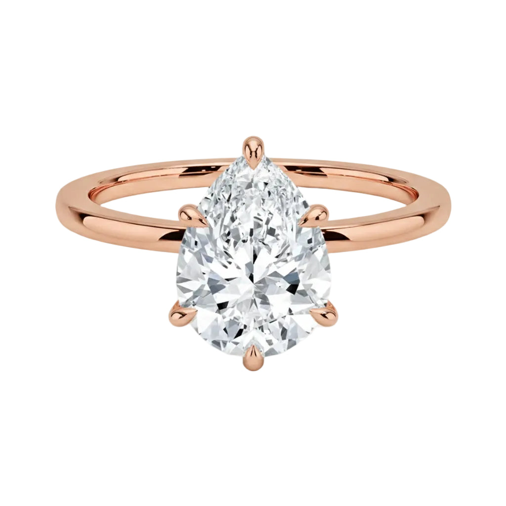 Close-up of a high-quality D-color VVS1 pear cut moissanite in a simple and elegant gold setting.