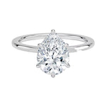 Close-up of a high-quality D-color VVS1 pear cut moissanite in a simple and elegant gold setting.