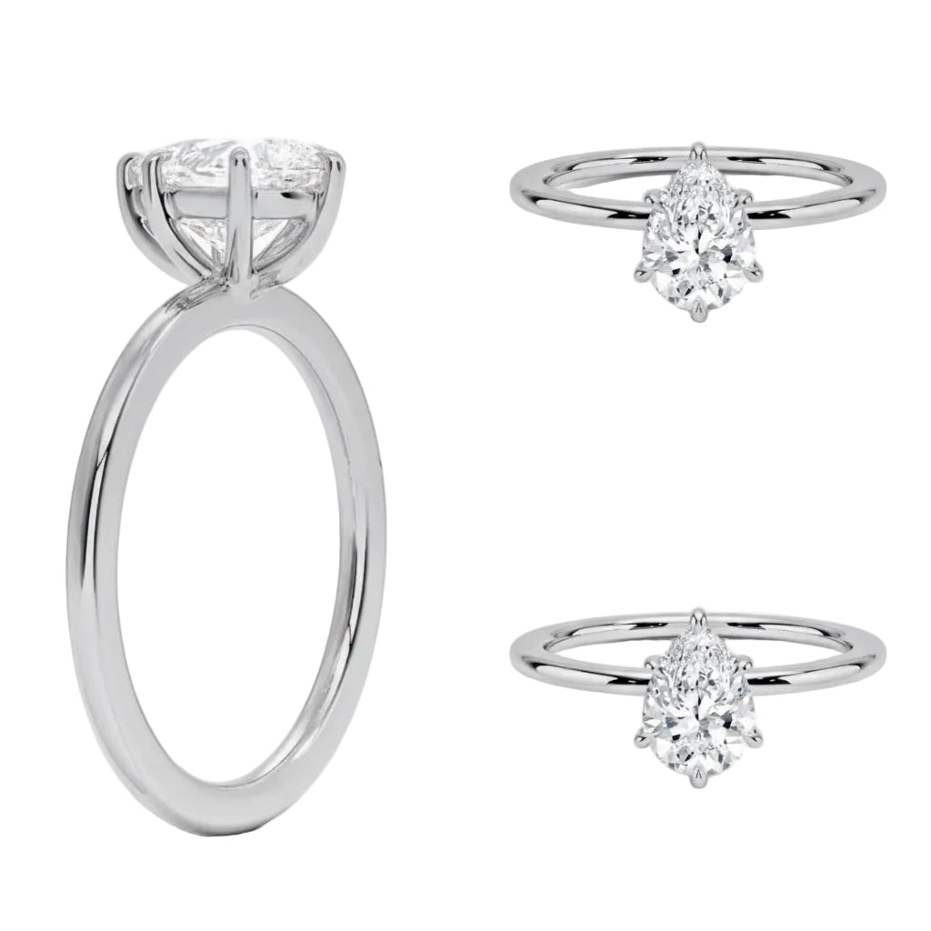 Detailed side view of a pear shaped moissanite ring showing the protective V-prong and slim gold band.