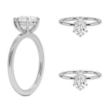 Detailed side view of a pear shaped moissanite ring showing the protective V-prong and slim gold band.