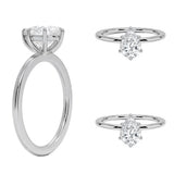 Detailed side view of a pear shaped moissanite ring showing the protective V-prong and slim gold band.