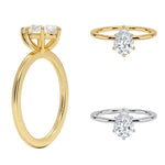 Detailed side view of a pear shaped moissanite ring showing the protective V-prong and slim gold band.