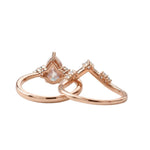 Detailed side view of the Pear Duo Chevron set showing the flush-fit V-shaped wedding band.