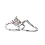 Detailed side view of the Pear Duo Chevron set showing the flush-fit V-shaped wedding band.