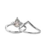 Detailed side view of the Pear Duo Chevron set showing the flush-fit V-shaped wedding band.