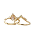 Detailed side view of the Pear Duo Chevron set showing the flush-fit V-shaped wedding band.