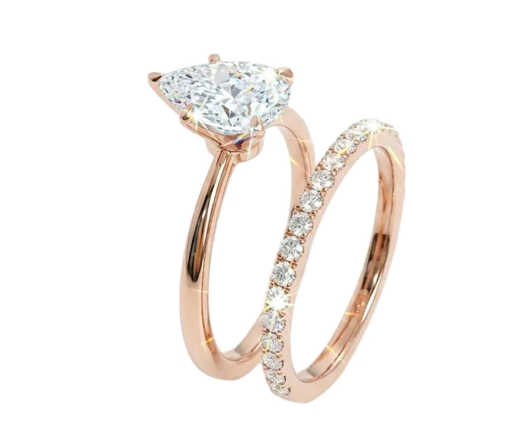 Detailed side view of the Pear Duo Grace set showing the flush-fit between the solitaire and eternity band.