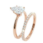 Detailed side view of the Pear Duo Grace set showing the flush-fit between the solitaire and eternity band.