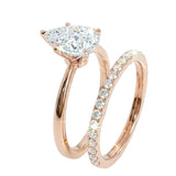 Detailed side view of the Pear Duo Grace set showing the flush-fit between the solitaire and eternity band.