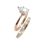 Close-up of a D-color VVS1 pear-cut moissanite demonstrating high-clarity facets and teardrop shape.