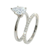 Detailed side view of the Pear Duo Grace set showing the flush-fit between the solitaire and eternity band.