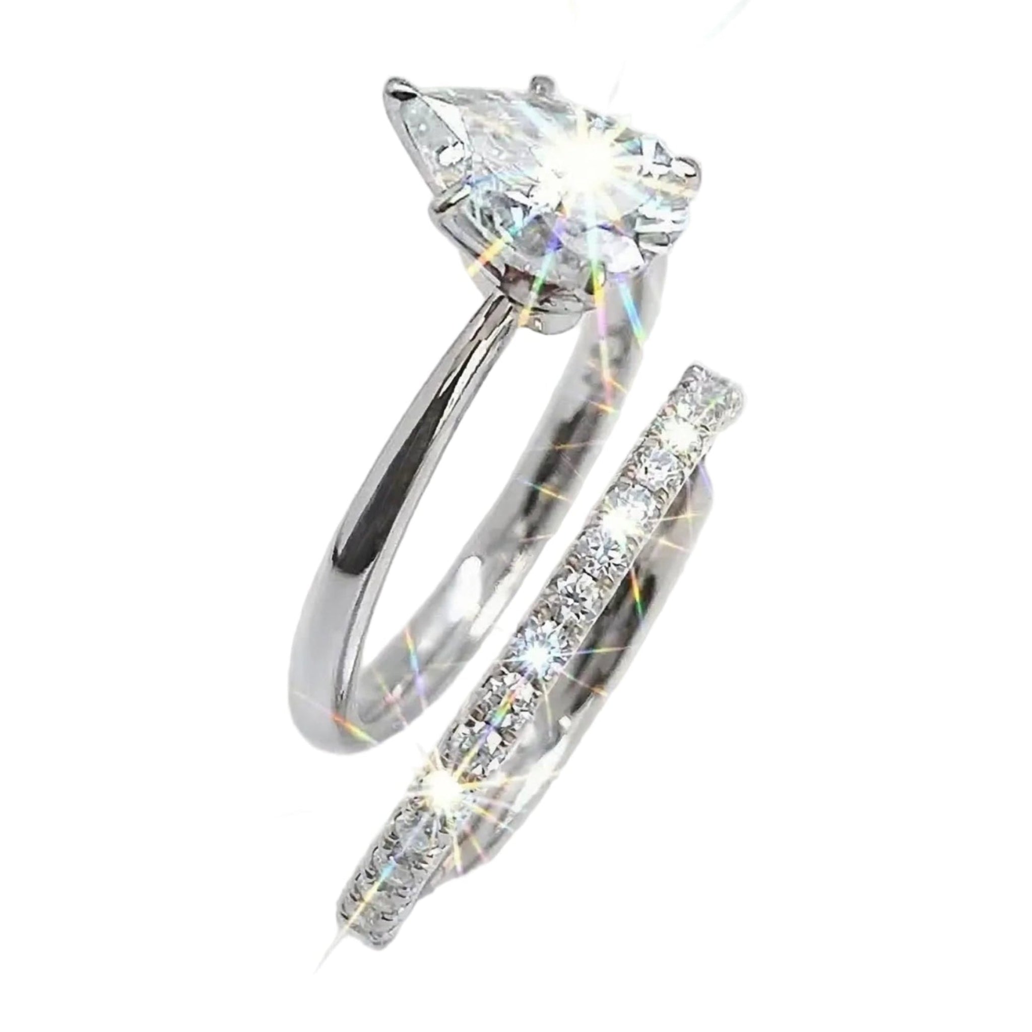 Three-prong pear-cut moissanite solitaire with a shimmering micro-pavé wedding ring in solid gold.