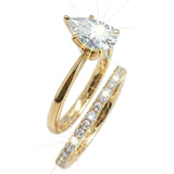 Detailed side view of the Pear Duo Grace set showing the flush-fit between the solitaire and eternity band.