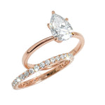 Close-up of a D-color VVS1 pear-cut moissanite demonstrating high-clarity facets and teardrop shape.