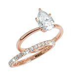 Close-up of a D-color VVS1 pear-cut moissanite demonstrating high-clarity facets and teardrop shape.