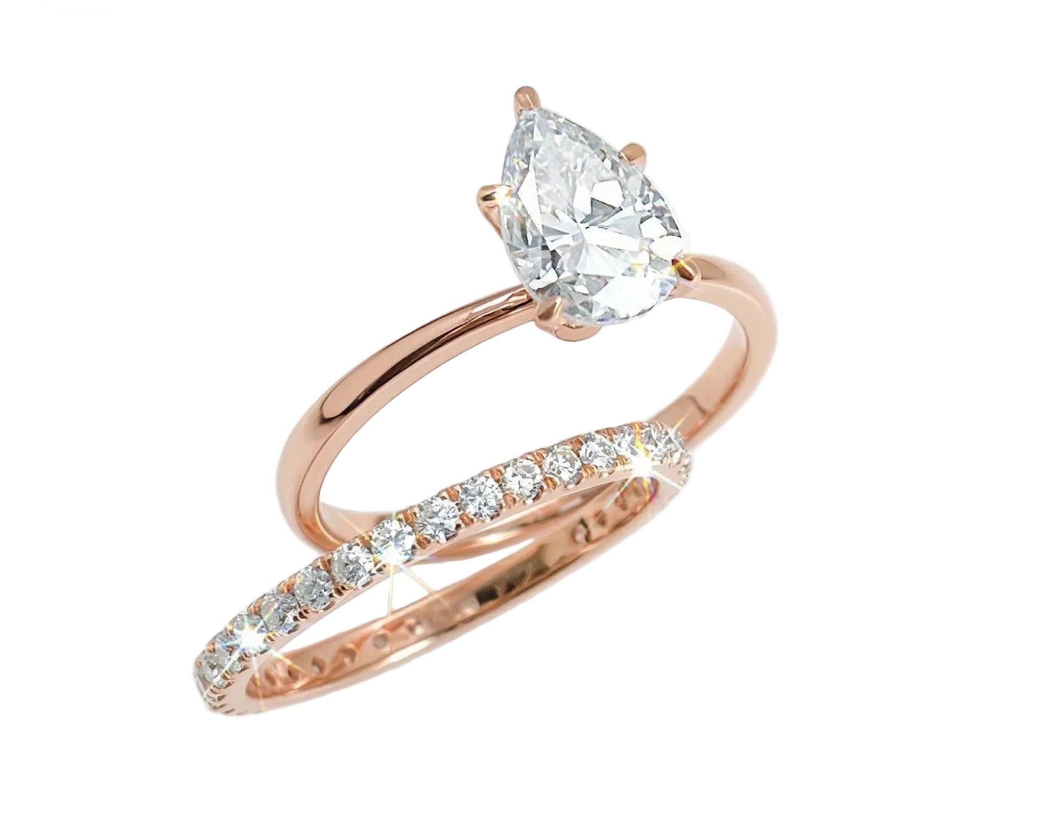 Close-up of a D-color VVS1 pear-cut moissanite demonstrating high-clarity facets and teardrop shape.