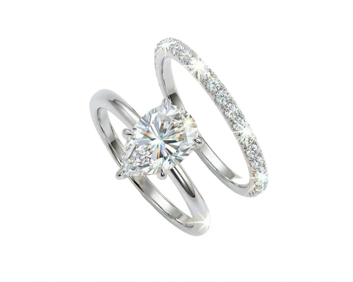 Pear brilliant moissanite solitaire engagement ring with a matching pavé eternity wedding band Duo Collection ApolloGem.
