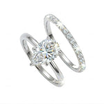 Pear brilliant moissanite solitaire engagement ring with a matching pavé eternity wedding band Duo Collection ApolloGem.