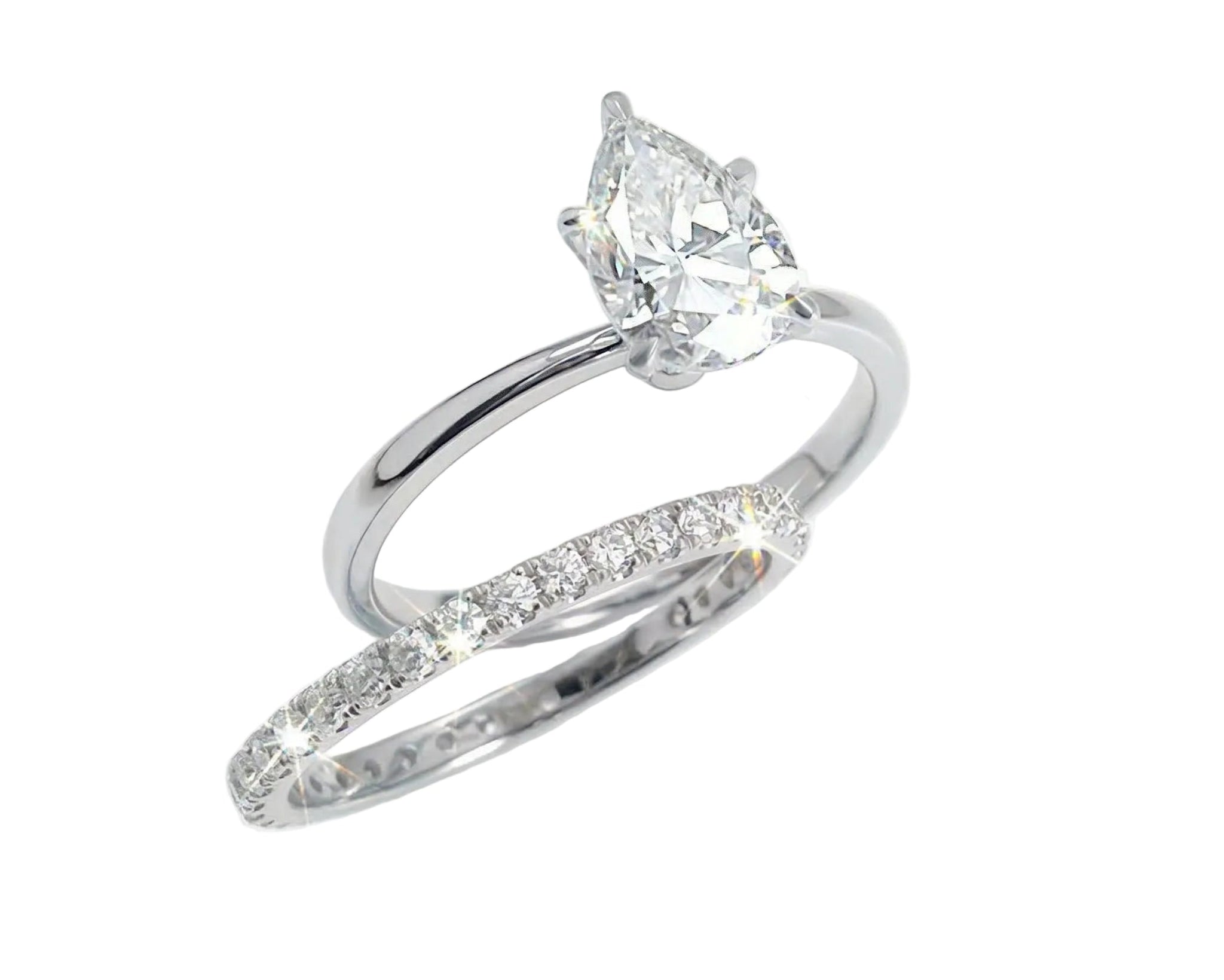 Close-up of a D-color VVS1 pear-cut moissanite demonstrating high-clarity facets and teardrop shape.