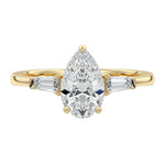 Luxury pear cut moissanite engagement ring in yellow gold with structural tapered baguette side stones ApolloGem South Africa.