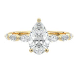 Secure three-prong pear cut moissanite ring with a half eternity triple marquise yellow gold band ApolloGem