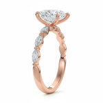 Top-down view of a D-color VVS1 pear brilliant moissanite in a rose gold solitaire setting.