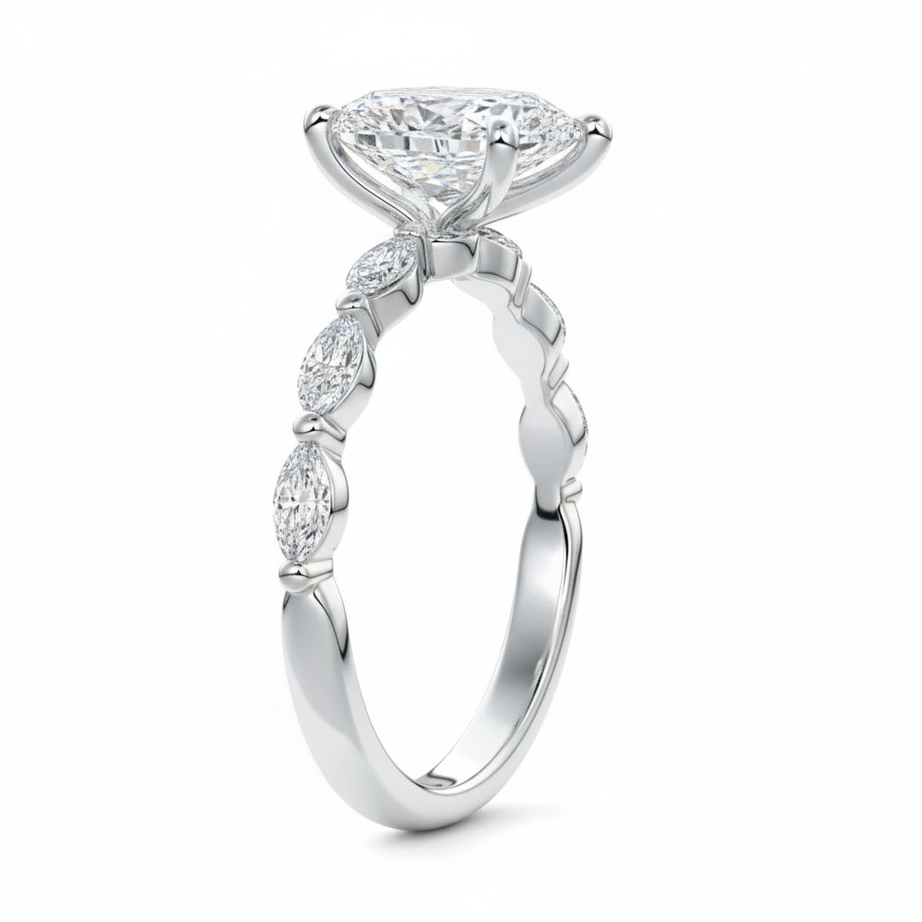 Top-down view of a D-color VVS1 pear brilliant moissanite in a white gold solitaire setting.