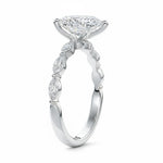 Top-down view of a D-color VVS1 pear brilliant moissanite in a white gold solitaire setting.