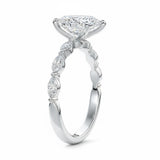 Top-down view of a D-color VVS1 pear brilliant moissanite in a white gold solitaire setting.