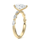Top-down view of a D-color VVS1 pear brilliant moissanite in a yellow gold solitaire setting.