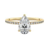 Dainty three-claw pear cut moissanite ring with a half eternity pavé band in yellow gold