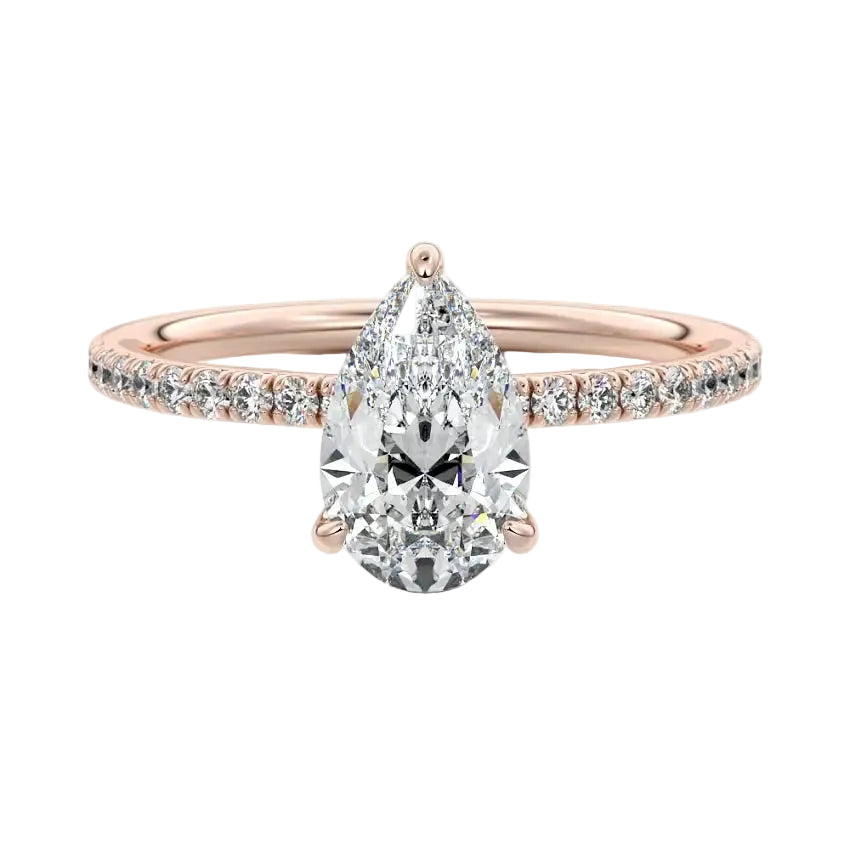 Dainty three-claw pear cut moissanite ring with a half eternity pavé band in rose gold