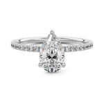 Dainty three-claw pear cut moissanite ring with a half eternity pavé band in white gold