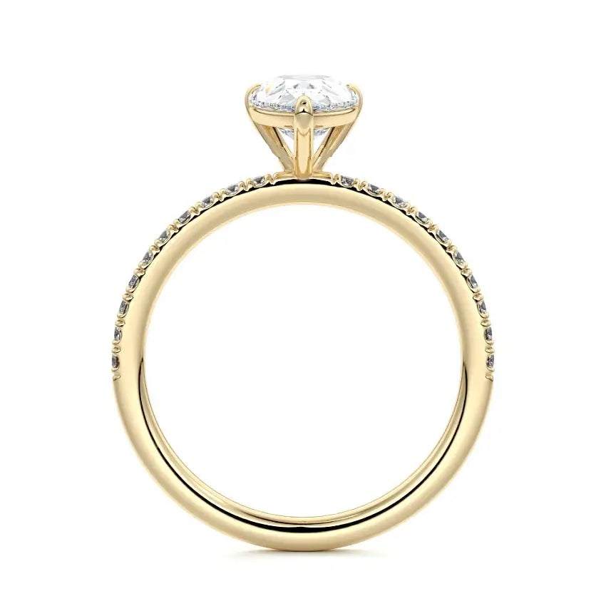 Side profile of the Pear Stacking Solitaire ring showing the refined basket and seamless integration.