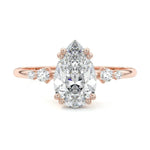Minimalist pear cut moissanite engagement ring in rose gold with four graduated round side stones ApolloGem South Africa.
