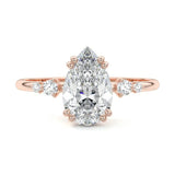 Minimalist pear cut moissanite engagement ring in rose gold with four graduated round side stones ApolloGem South Africa.