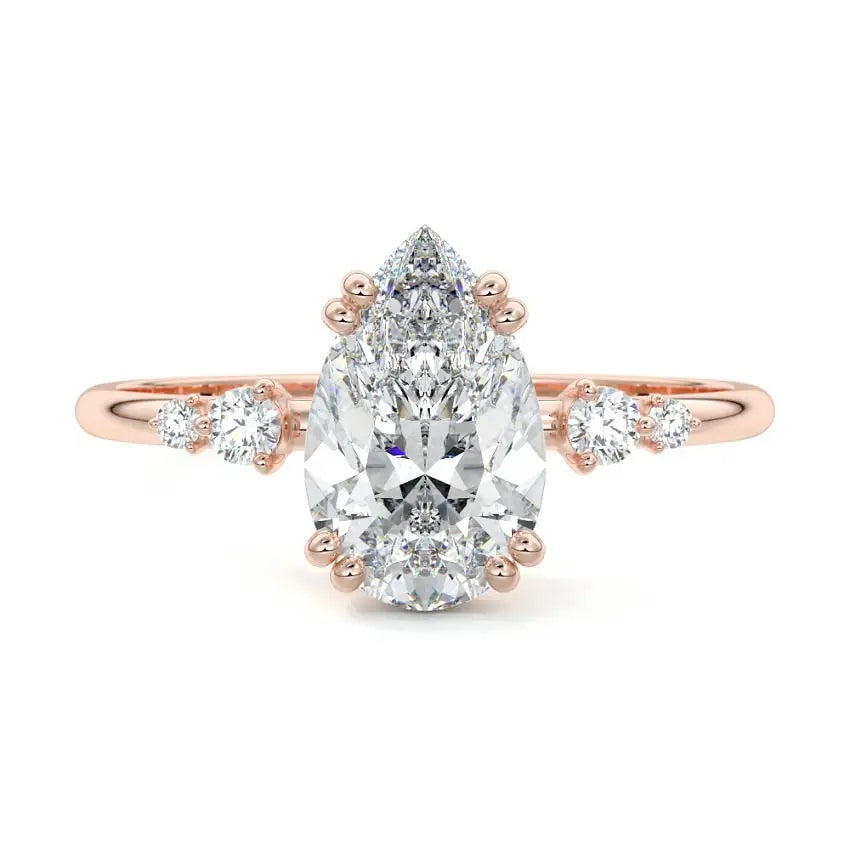 Minimalist pear cut moissanite engagement ring in rose gold with four graduated round side stones ApolloGem South Africa.