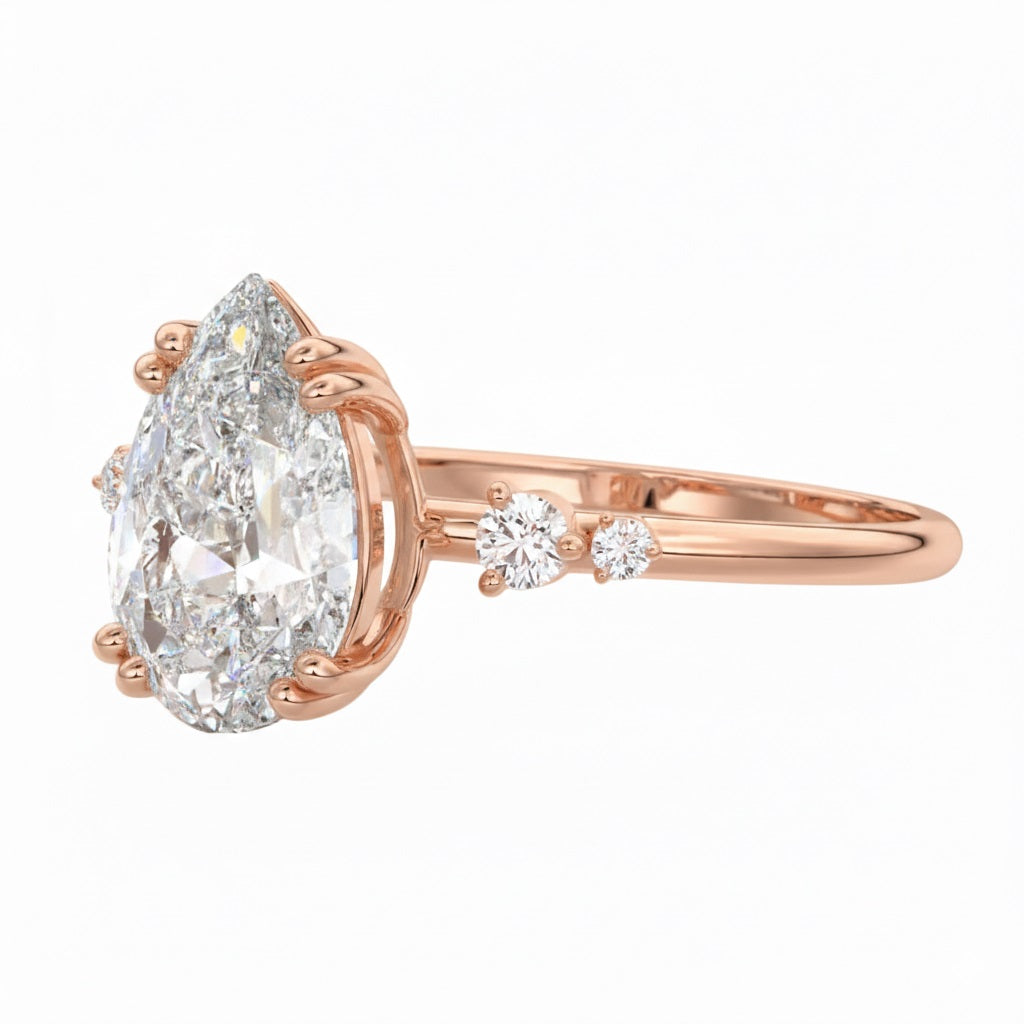 Side view of a pear shaped moissanite ring showing a protective V-prong setting and high-quality GRI certified stones.