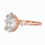 Side view of a pear shaped moissanite ring showing a protective V-prong setting and high-quality GRI certified stones.