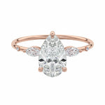 Pear cut moissanite engagement ring rose gold marquise side stones botanical design