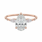 Pear cut moissanite engagement ring rose gold marquise side stones botanical design