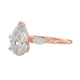 Nature inspired pear moissanite ring with leaf accents and slim band ApolloGem