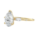 Nature inspired pear moissanite ring with leaf accents and slim band ApolloGem