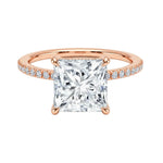 Secure four-claw princess cut moissanite ring with a uniform pavé-set rose gold band ApolloGem.