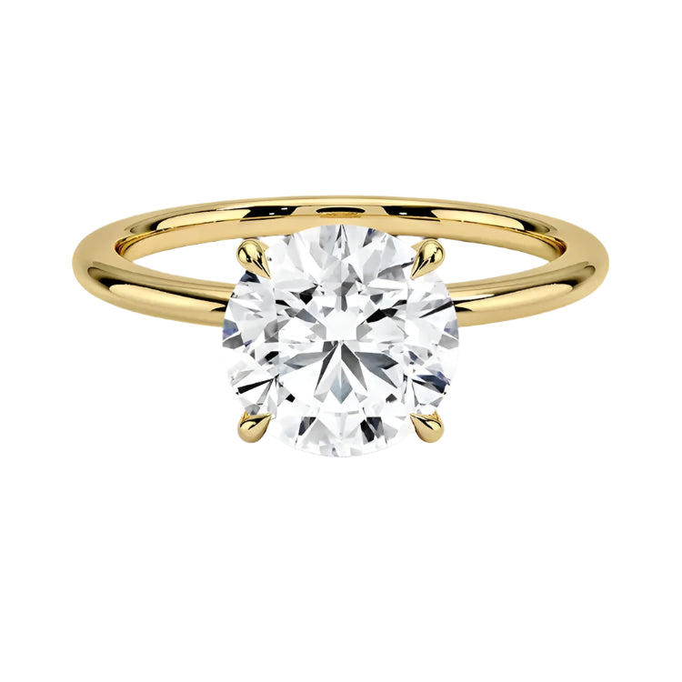 The Pure Round Solitaire minimalist engagement ring in yellow gold by ApolloGem.