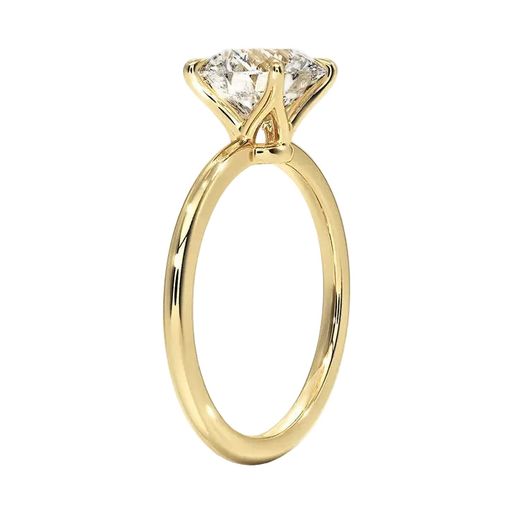 Side view of a traditional four-prong round moissanite ring showing the slim polished gold band.
Engagement ring round cut Moissanite lab grown diamond engagement ring round shank with a four claw setting, on a gold band, against a white background.Moissanite engagement ring cape town south africa grand diamonds ralph jacobs jeulia 