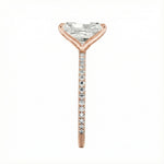 Top-down view of a D-color VVS1 radiant stone in a rose  gold 3/4 pavé setting.
